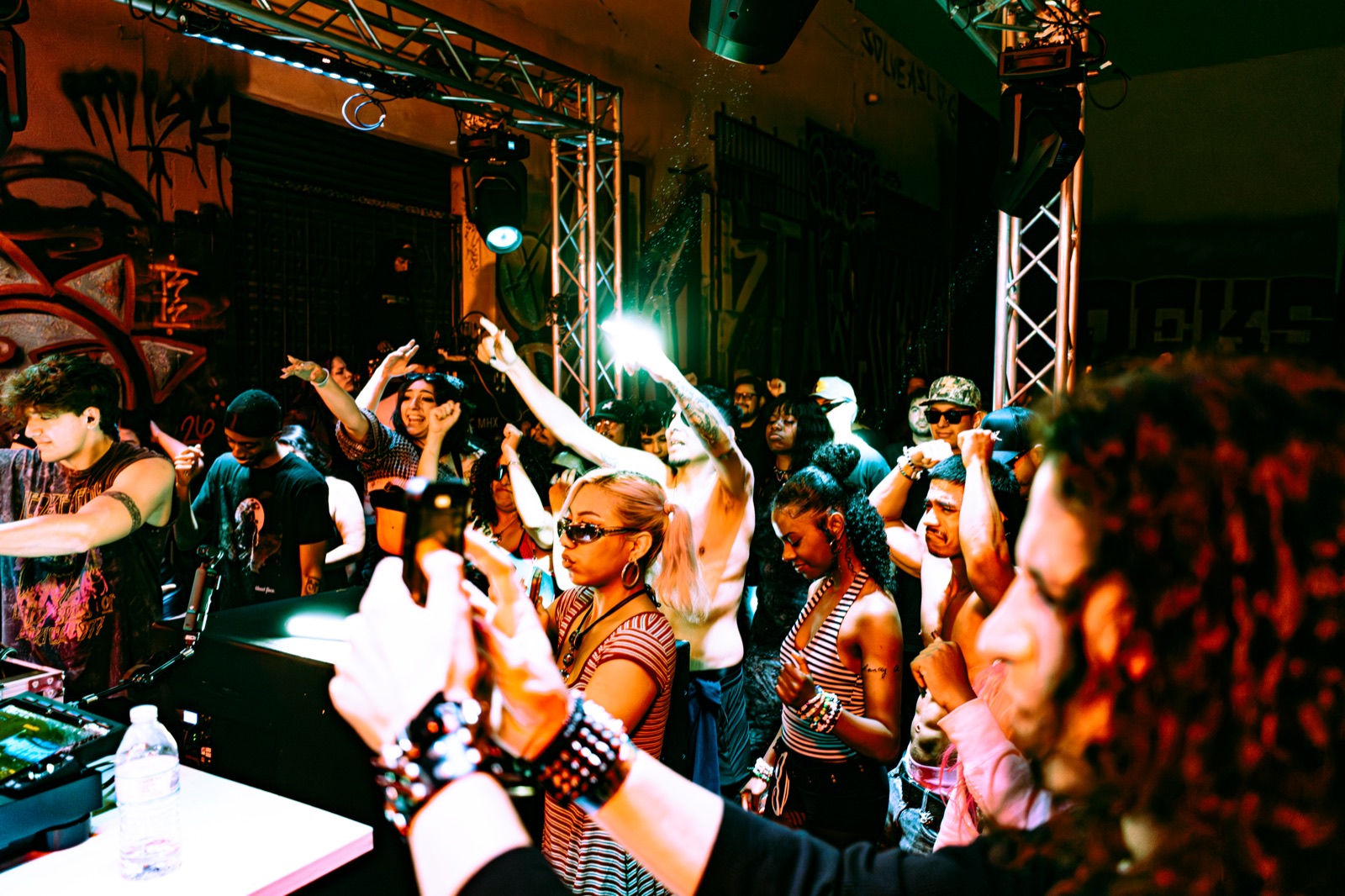 Two guests dancing in silhouette beneath the disco ball